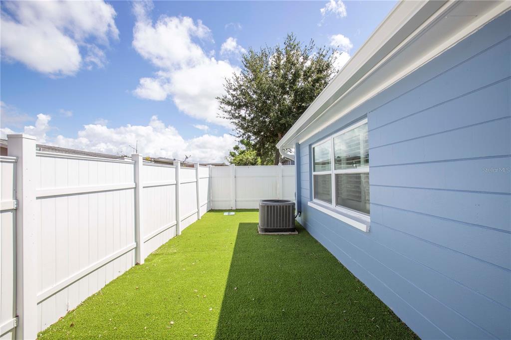 5240 School Road New Port Richey, FL 34653 - Photo 28 of 32 a view of a backyard with garden