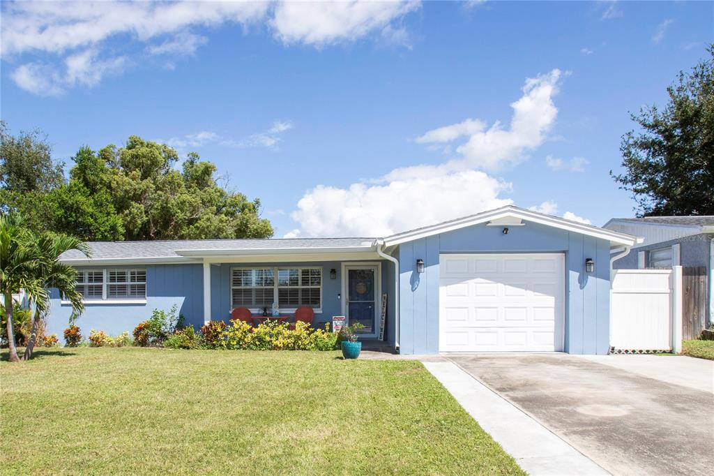 5240 School Road New Port Richey, FL 34653 - Photo 32 of 32 a front view of a house with garden