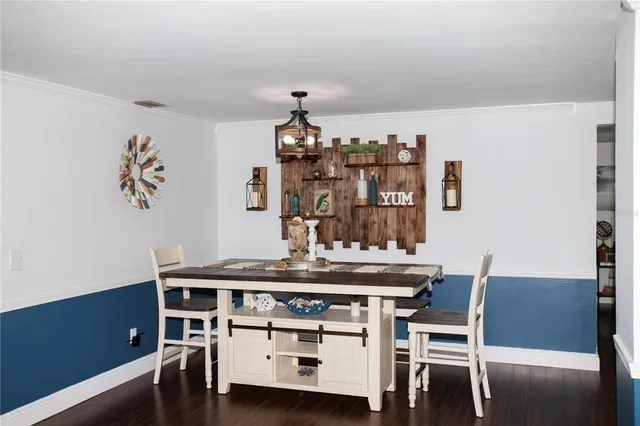 a dining room with a table and chairs