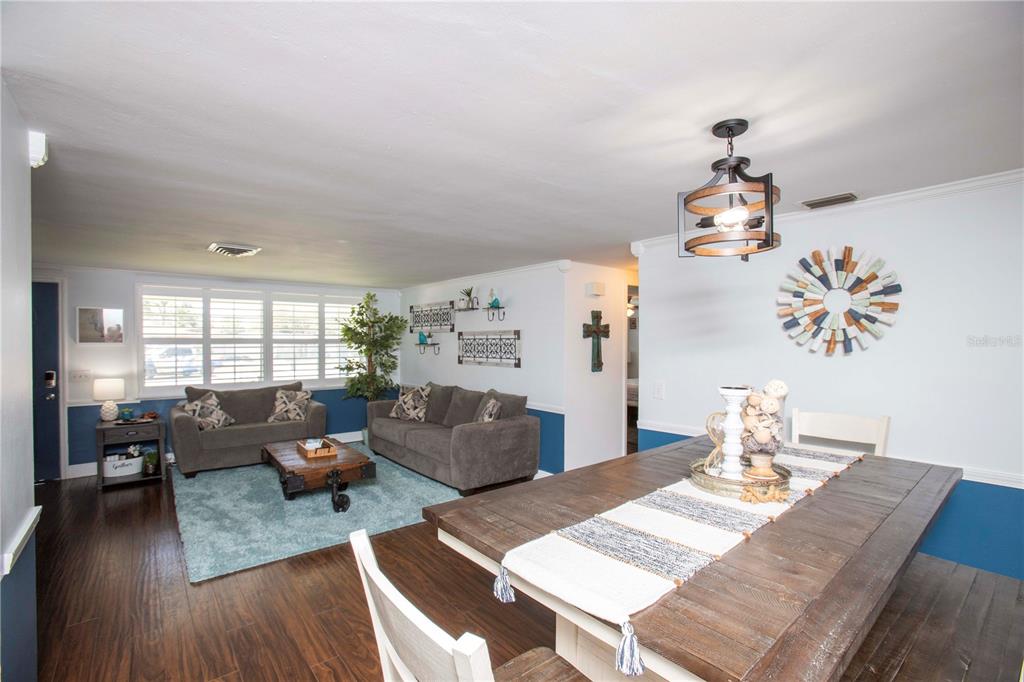 5240 School Road New Port Richey, FL 34653 - Photo 8 of 32 a living room with furniture and wooden floor