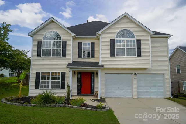 front view of a house with a yard