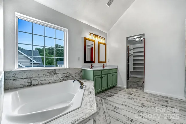 a bathroom with a shower and a glass door