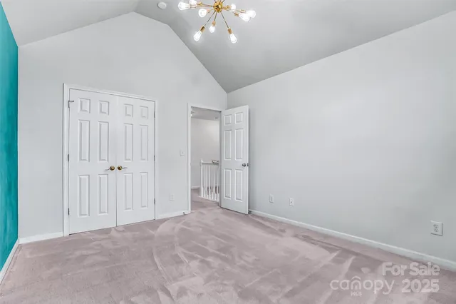 a bathroom with a sink mirror toilet and next to a window
