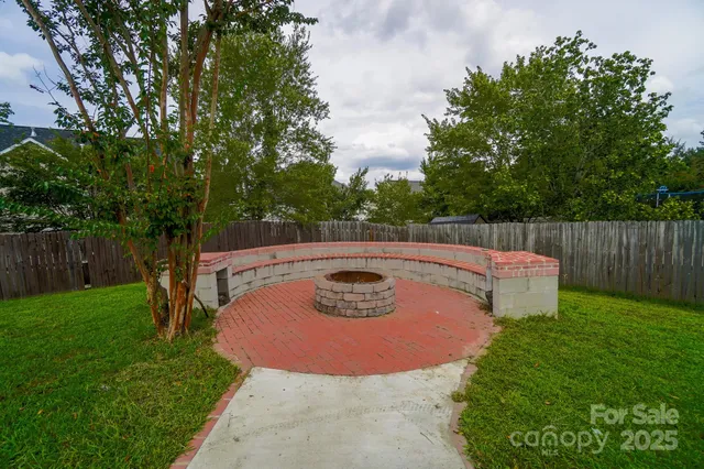 a view of a backyard with sitting area