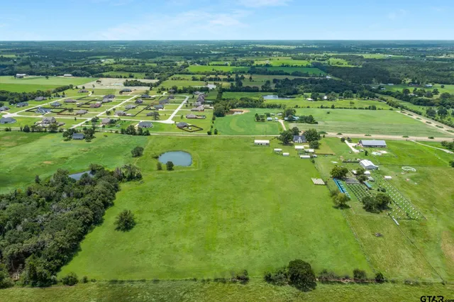 a view of a field with an ocean