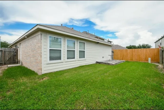 a view of a backyard with a garden