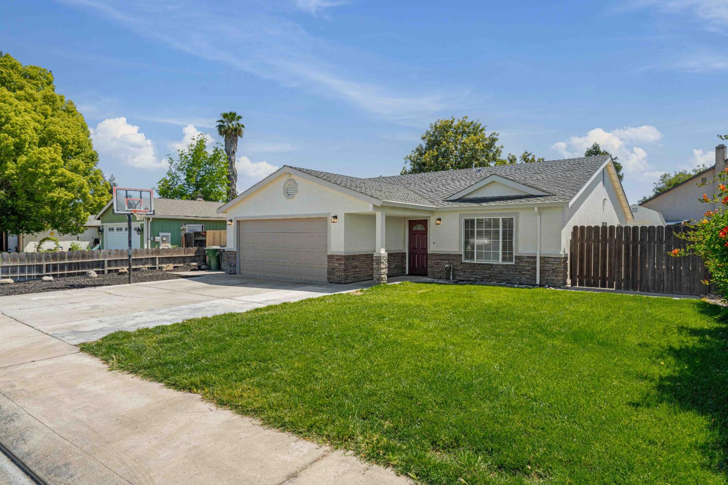1464 Denise Drive Ripon, CA 95366 - Photo 2 of 41 a front view of a house with a garden