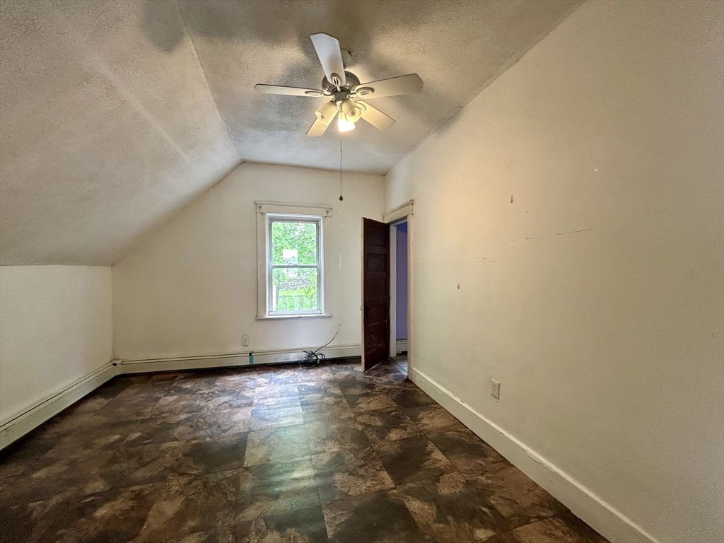3 Gloucester Road Worcester, MA 01607 - Photo 6 of 12 an empty room with closet and a chandelier fan