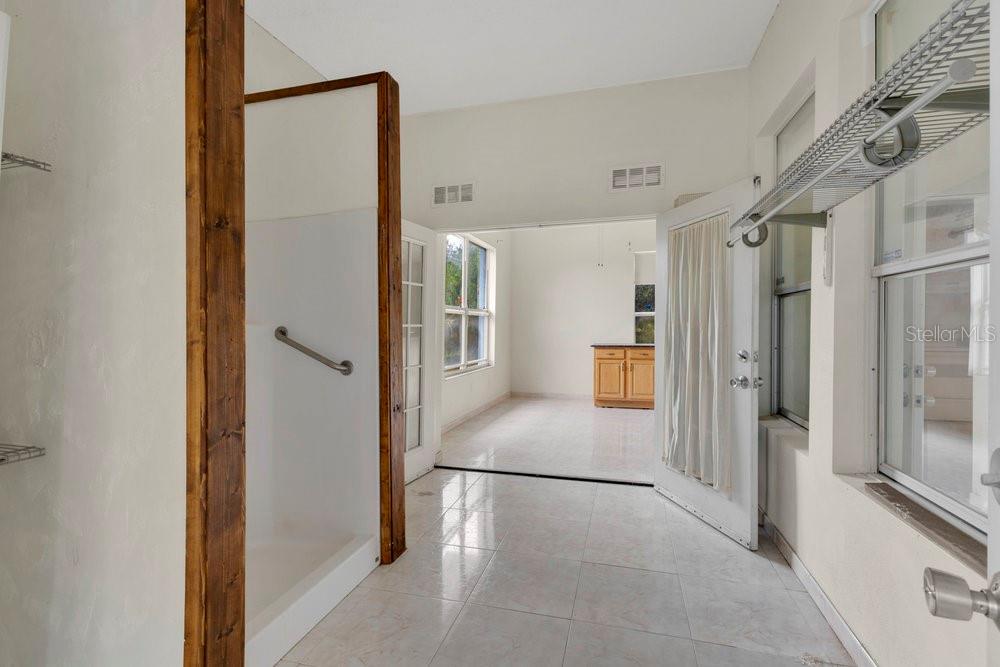 4110 Santa Barbara Road Kissimmee, FL 34746 - Photo 2 of 32 a view of a hallway with a white refrigerator