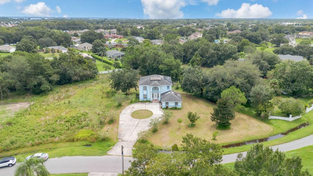 4110 Santa Barbara Road Kissimmee, FL 34746 - Photo 21 of 32 an aerial view of a house with yard swimming pool and outdoor seating