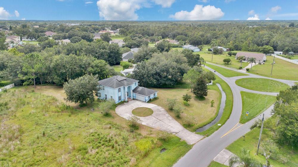 4110 Santa Barbara Road Kissimmee, FL 34746 - Photo 27 of 32 an aerial view of a house with a swimming pool