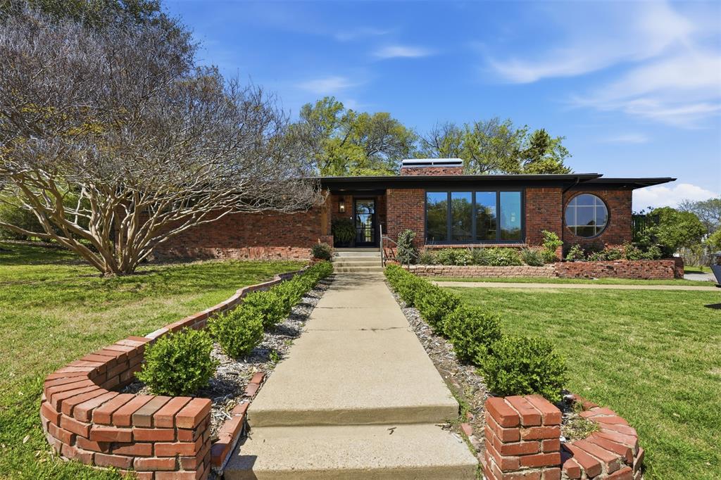 3800 West Clayton Road Fort Worth, TX 76116 - Photo 1 of 1 a front view of a house with garden