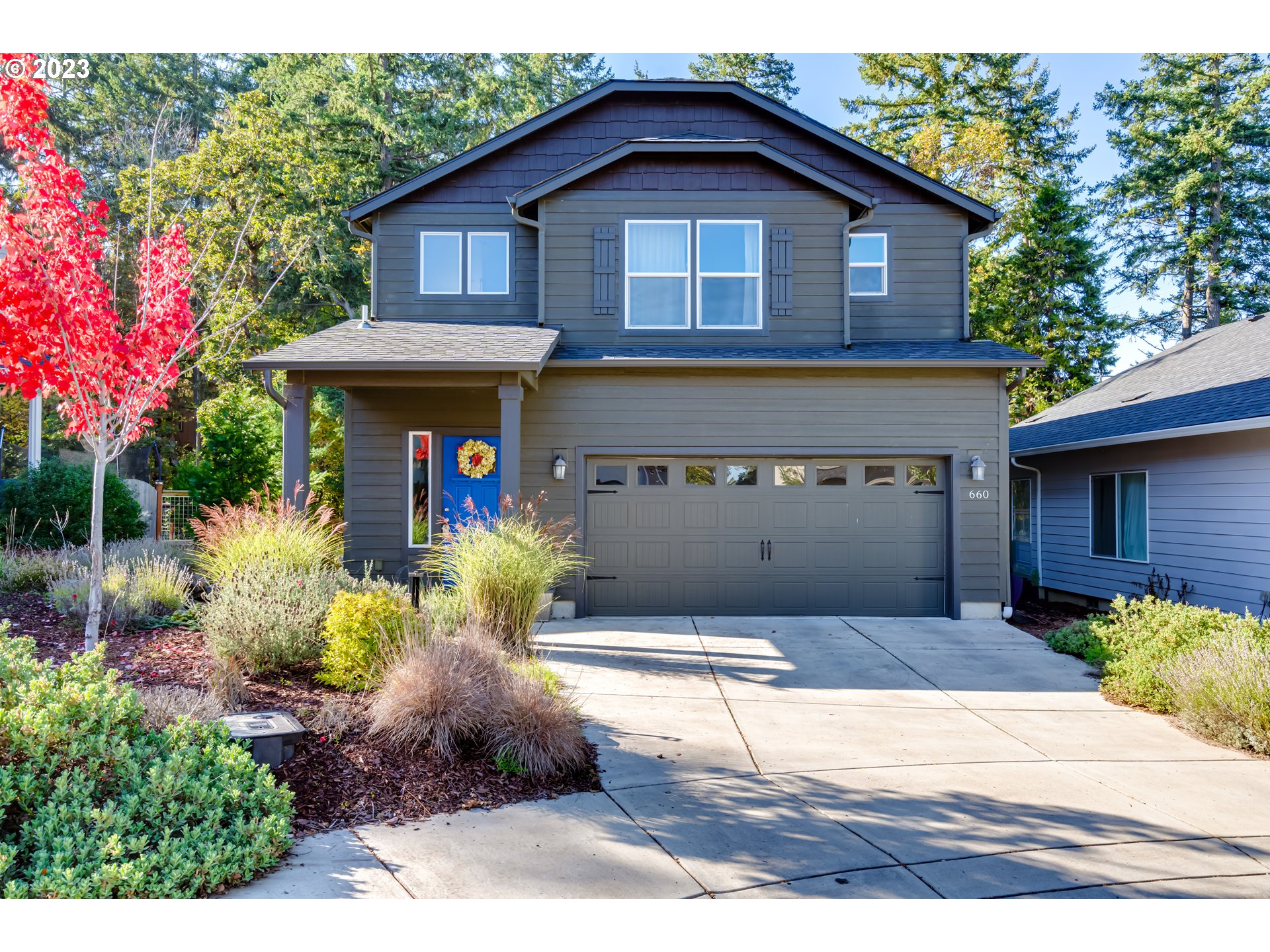 a front view of a house with a yard