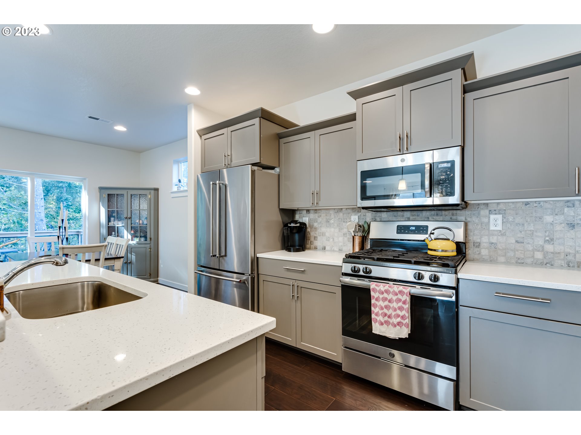 660 Fox Pine Lane Eugene, OR 97405 - Photo 16 of 48 a kitchen with a sink a stove and refrigerator