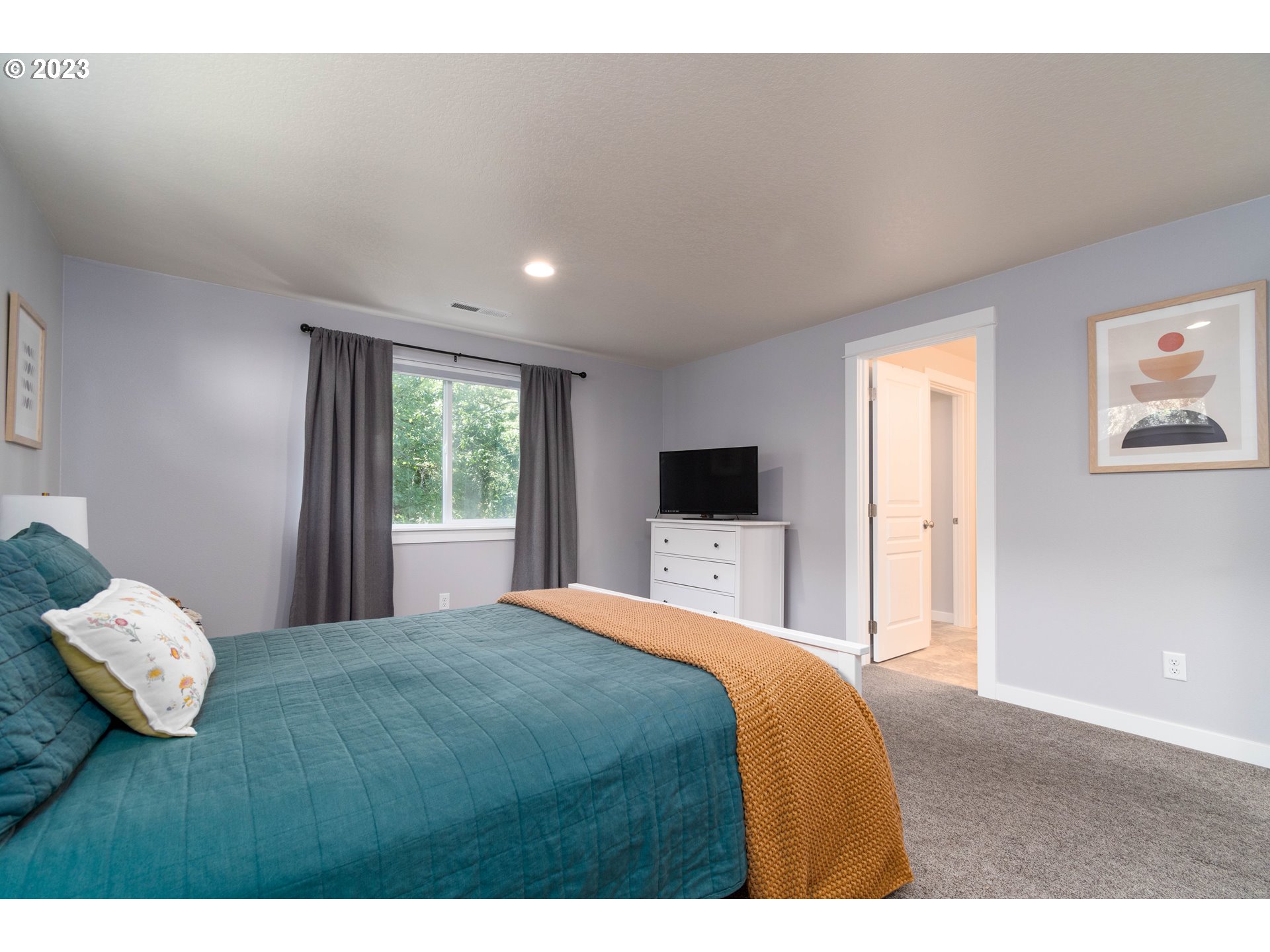 660 Fox Pine Lane Eugene, OR 97405 - Photo 24 of 48 a bedroom with a bed and a window