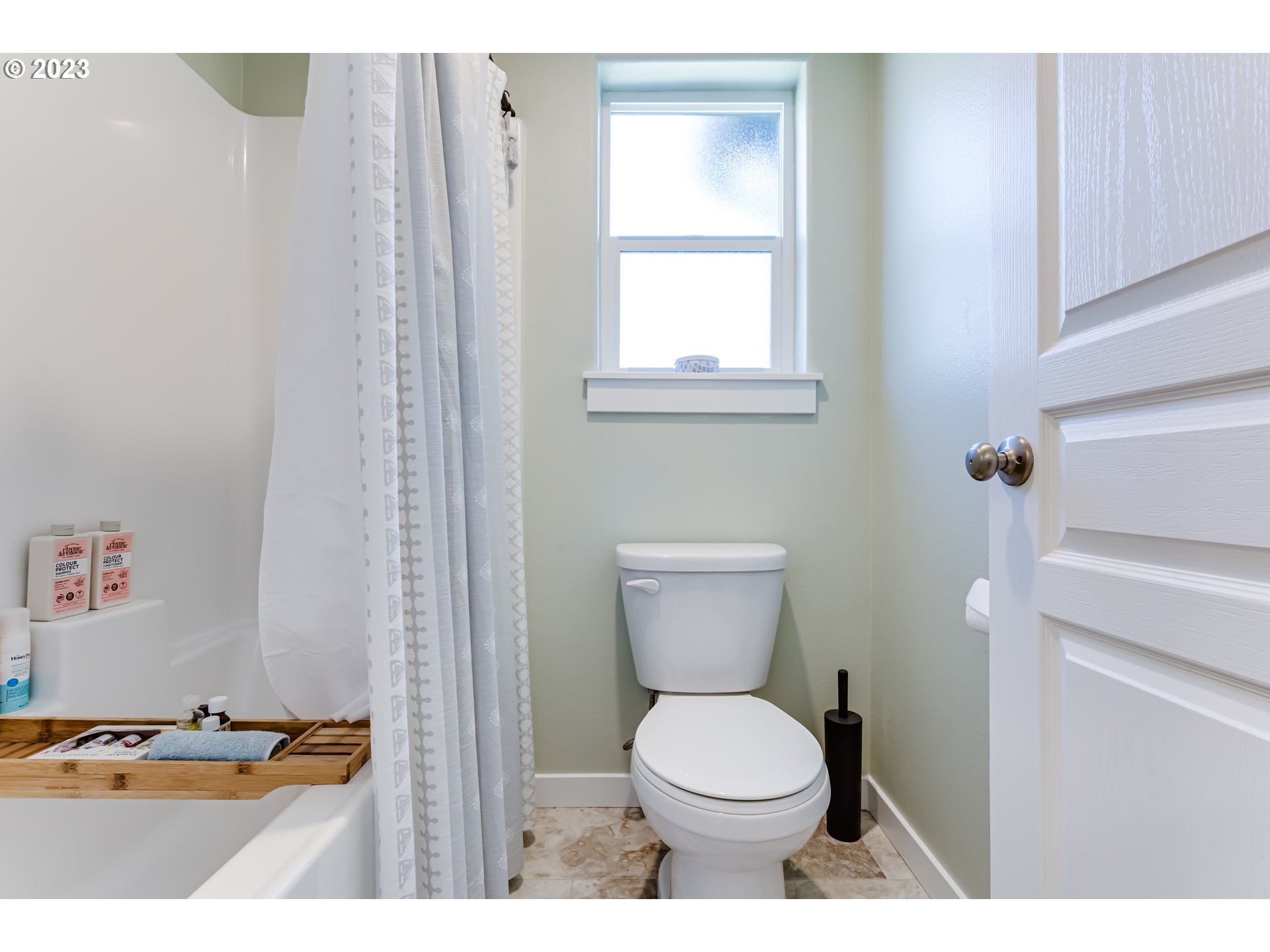 660 Fox Pine Lane Eugene, OR 97405 - Photo 32 of 48 a bathroom with a toilet a sink and a window
