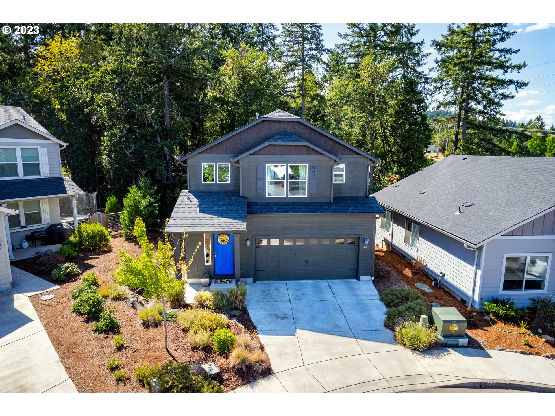 660 Fox Pine Lane Eugene, OR 97405 - Photo 44 of 48 a front view of a house with a yard