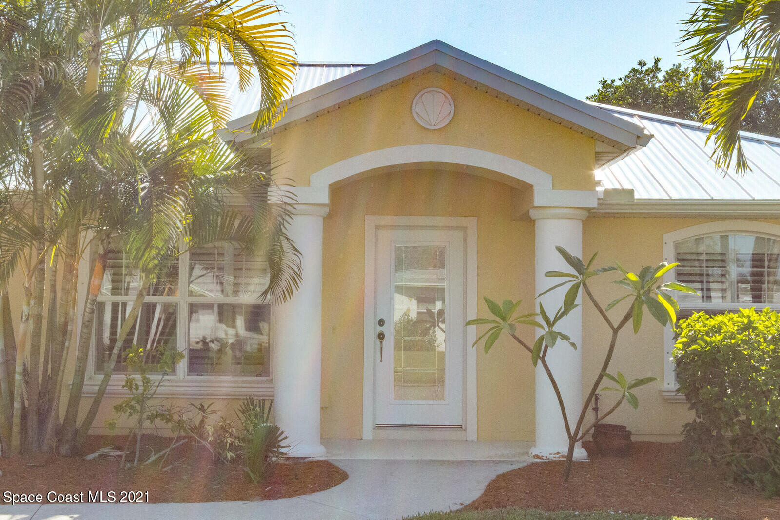 2524 Carmel Road Indialantic, FL 32903 - Photo 2 of 30 a front view of a house with a yard