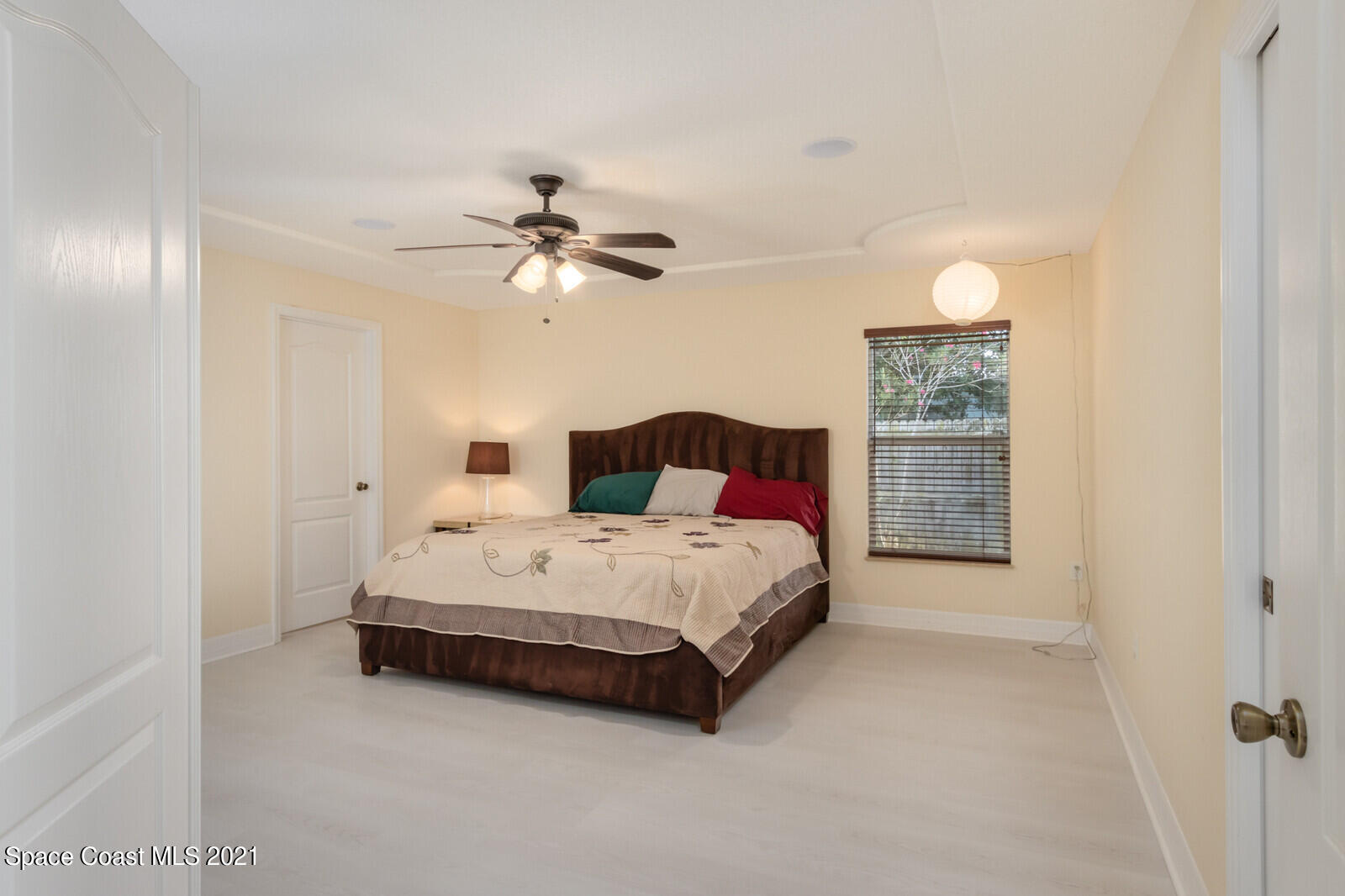2524 Carmel Road Indialantic, FL 32903 - Photo 13 of 30 a spacious bedroom with a bed and a window