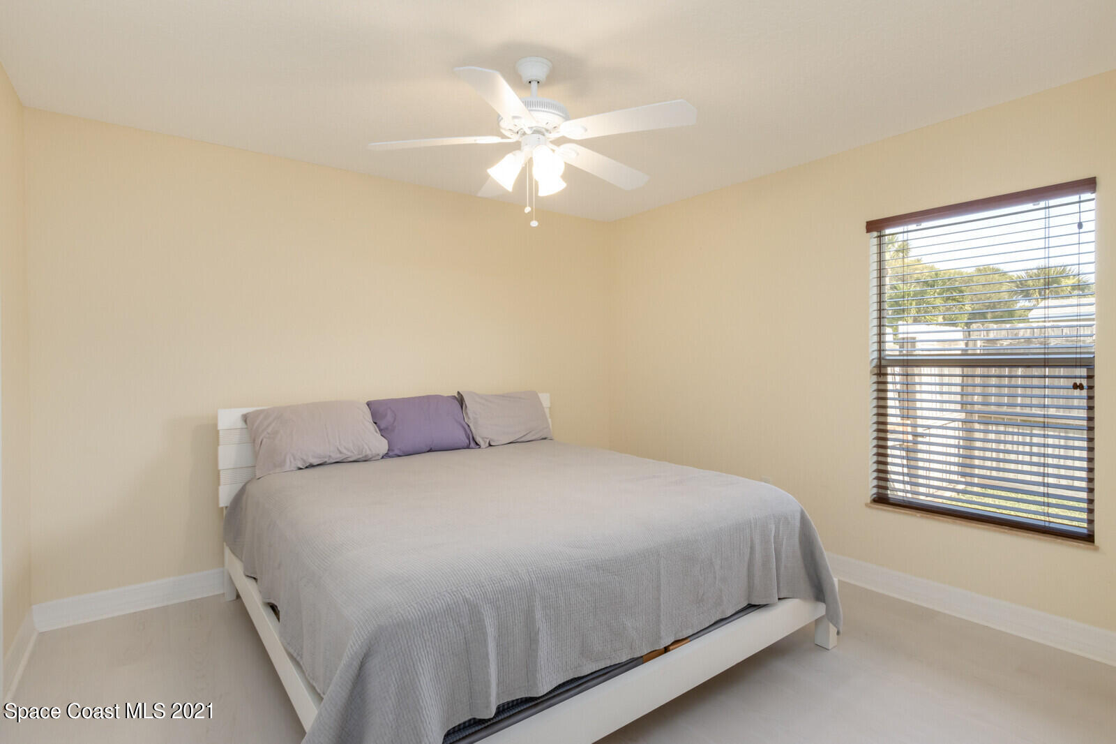 2524 Carmel Road Indialantic, FL 32903 - Photo 21 of 30 a bedroom with a bed and a window