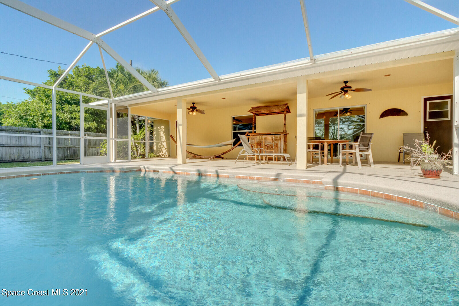 2524 Carmel Road Indialantic, FL 32903 - Photo 26 of 30 a swimming pool with outdoor seating and yard