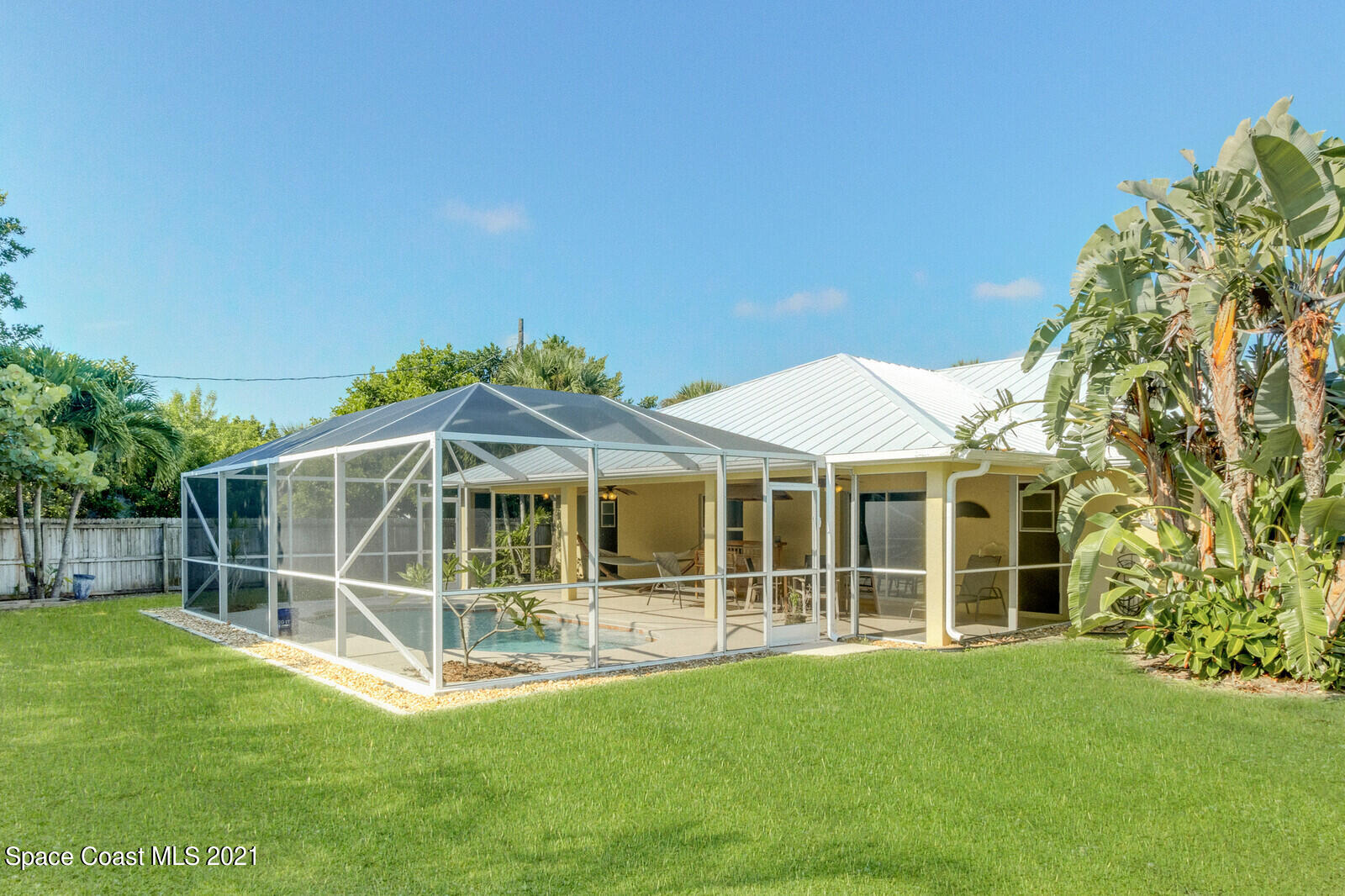 2524 Carmel Road Indialantic, FL 32903 - Photo 27 of 30 a view of a house with a backyard and a garden