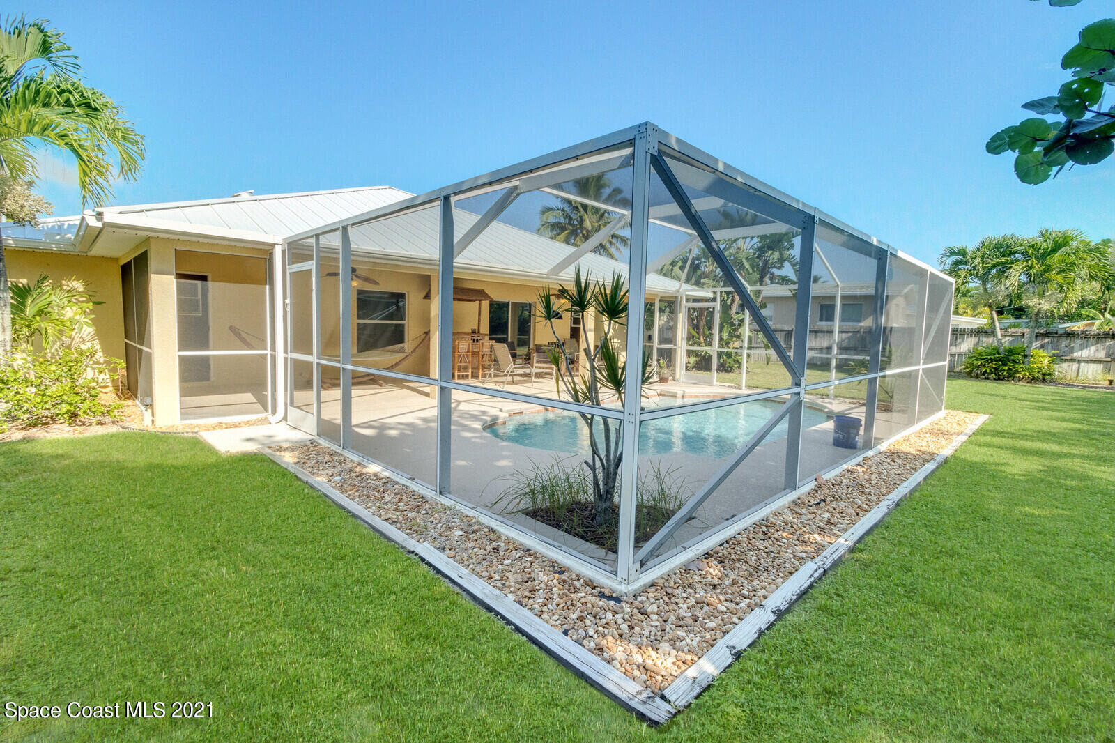 2524 Carmel Road Indialantic, FL 32903 - Photo 28 of 30 a front view of a house with a garden