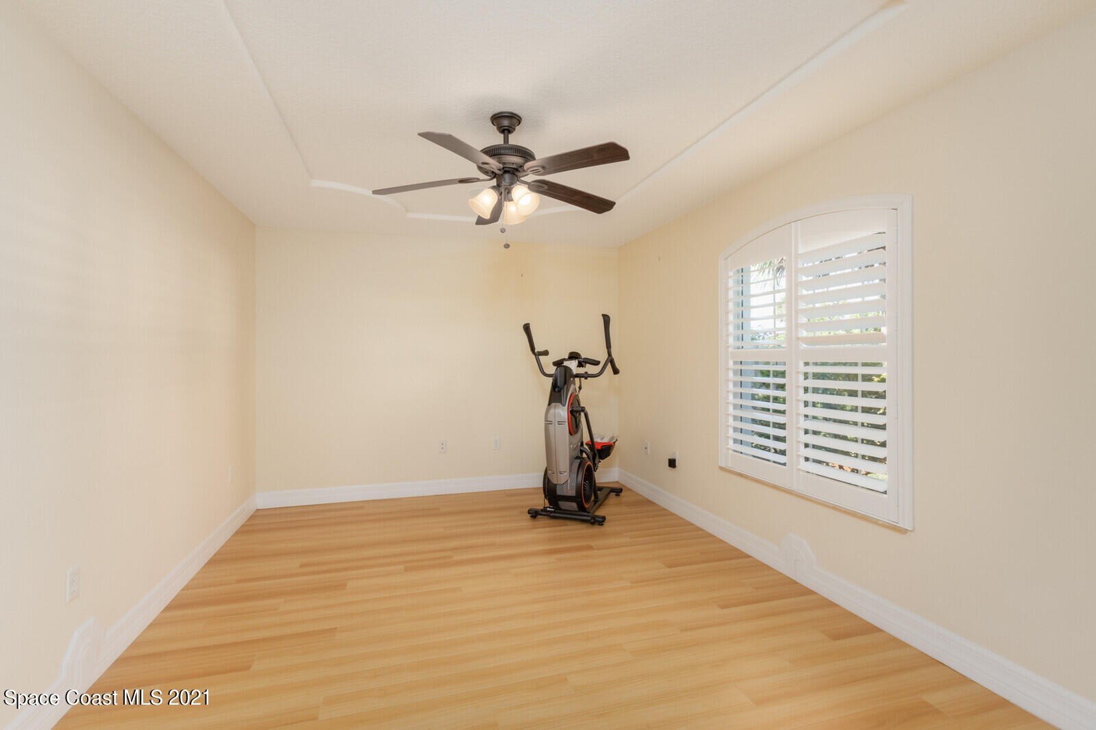 2524 Carmel Road Indialantic, FL 32903 - Photo 4 of 30 a view of a room with gym equipment and a window