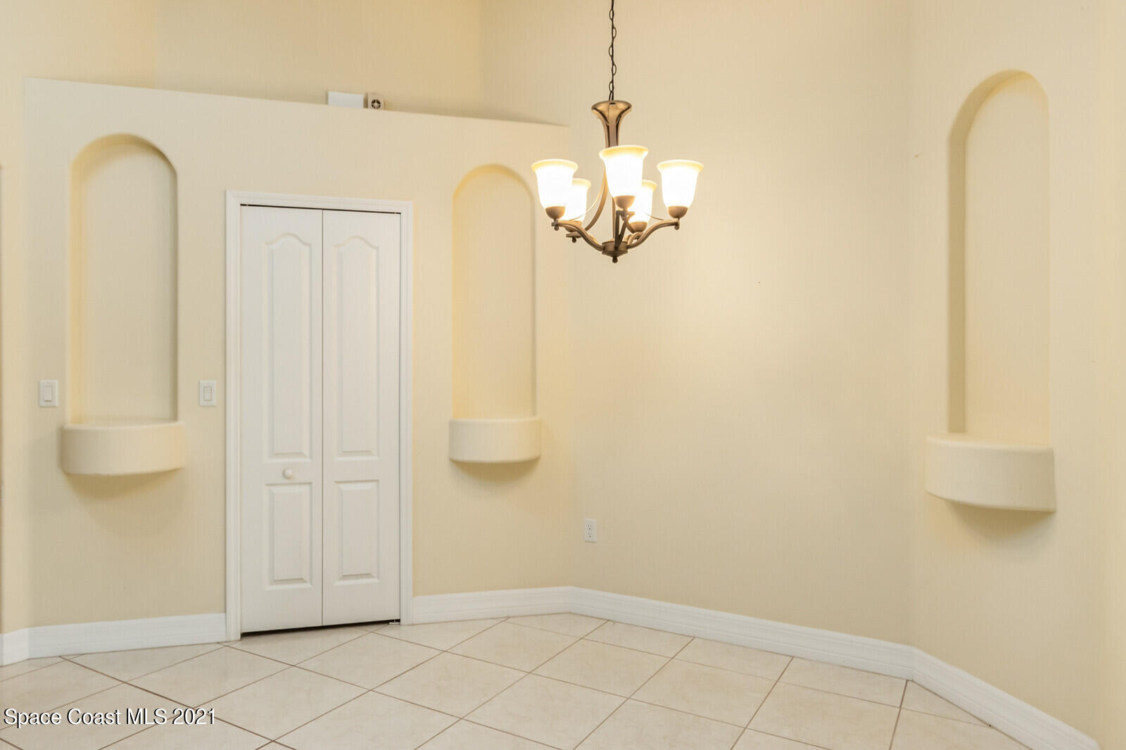 2524 Carmel Road Indialantic, FL 32903 - Photo 10 of 30 a view of a room with wooden floor and cabinet