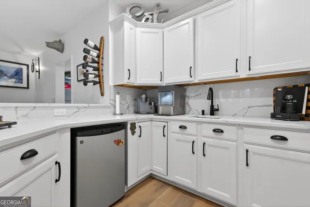 a view of a balcony with two chairs and a table