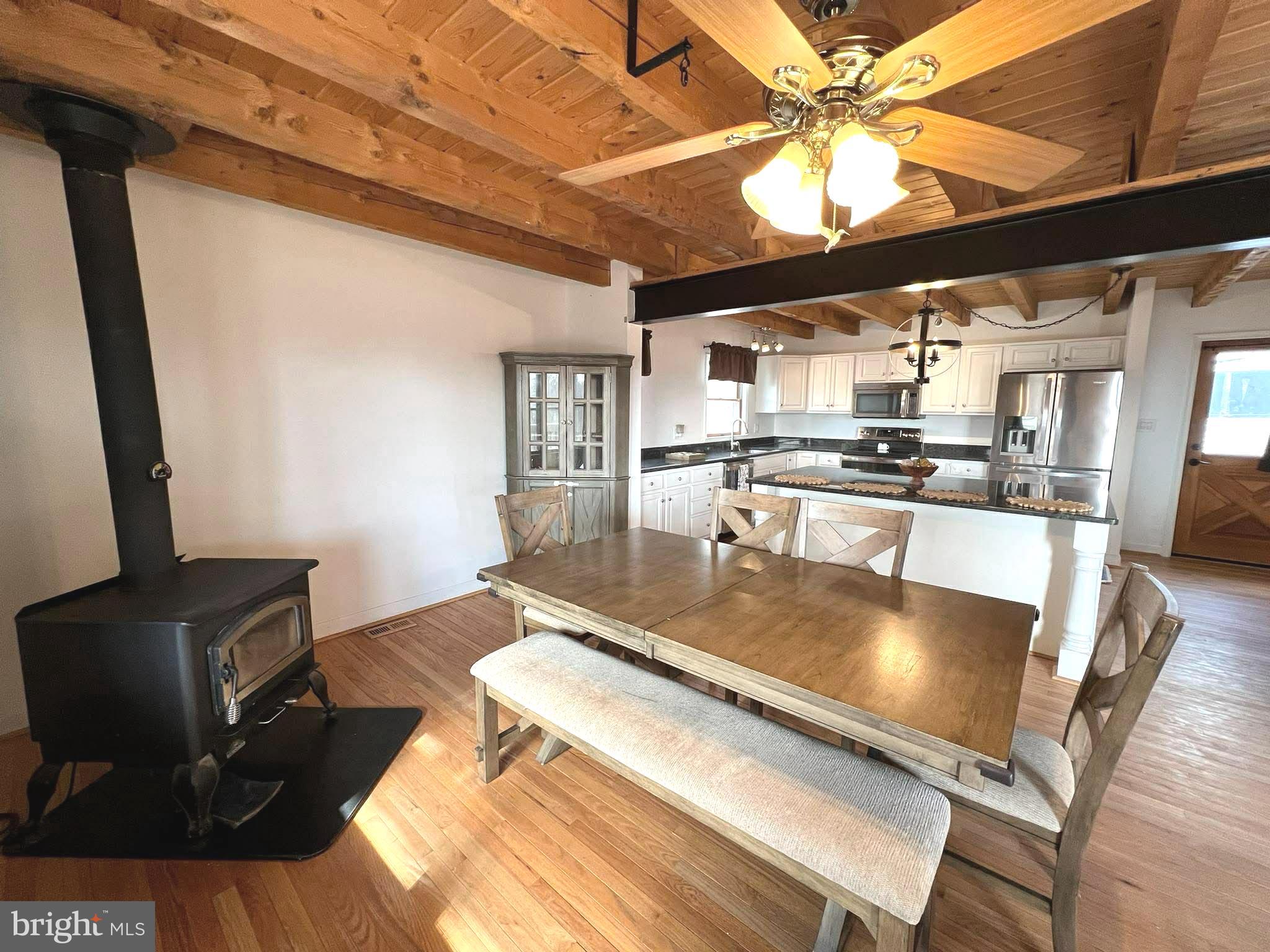 10680 Allens Fresh Road Charlotte Hall, MD 20622 - Photo 12 of 22 a living room with stainless steel appliances furniture a rug and a kitchen view
