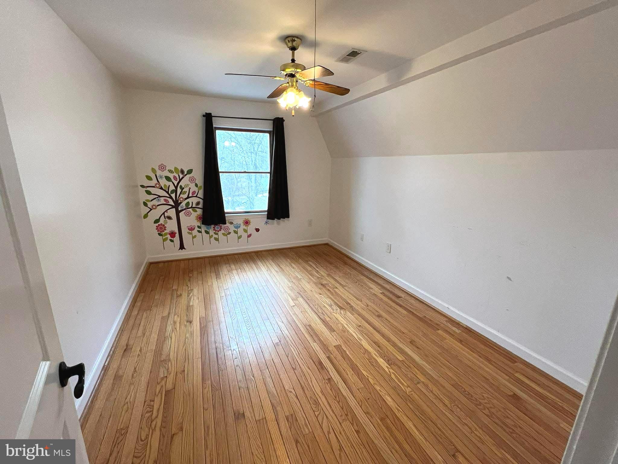 10680 Allens Fresh Road Charlotte Hall, MD 20622 - Photo 18 of 22 wooden floor in an empty room with a window