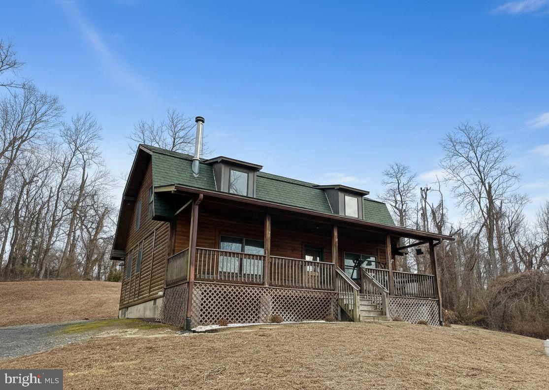 10680 Allens Fresh Road Charlotte Hall, MD 20622 - Photo 2 of 22 a front view of a house with a yard