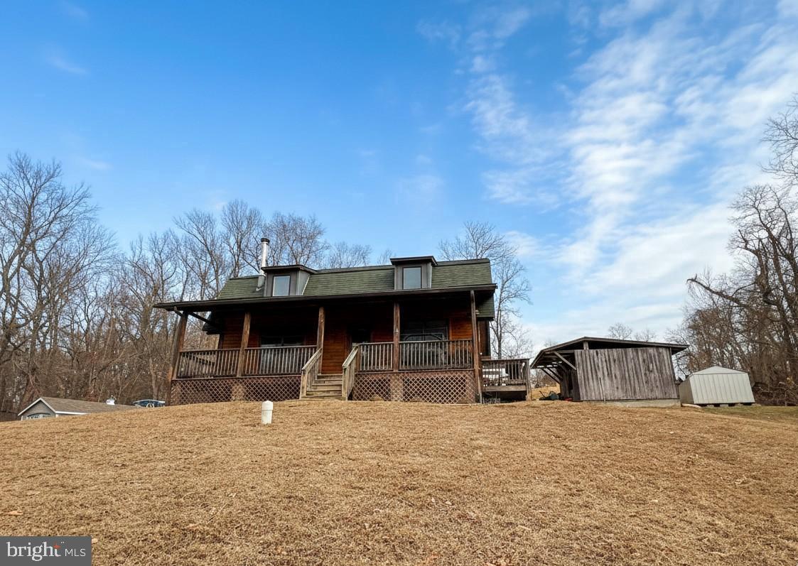 10680 Allens Fresh Road Charlotte Hall, MD 20622 - Photo 5 of 22 a front view of a house with a yard and garage