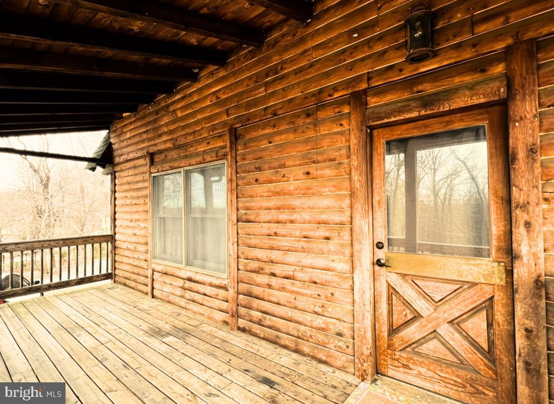 10680 Allens Fresh Road Charlotte Hall, MD 20622 - Photo 7 of 22 a view of a balcony with wooden floor