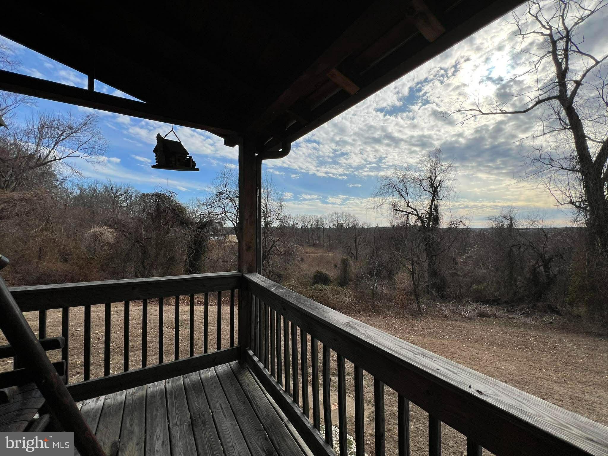 10680 Allens Fresh Road Charlotte Hall, MD 20622 - Photo 8 of 22 a view of a balcony with a yard