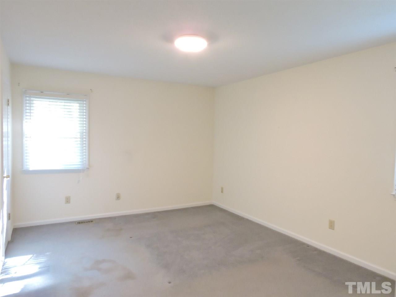 5610 Roslyn Road Durham, NC 27712 - Photo 14 of 18 an empty room with a window