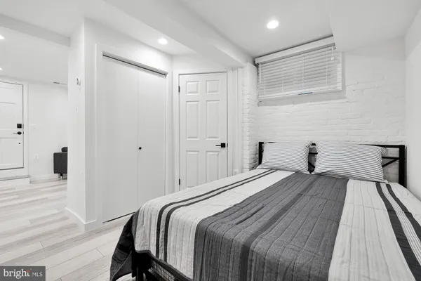 a bedroom with a bed and a table