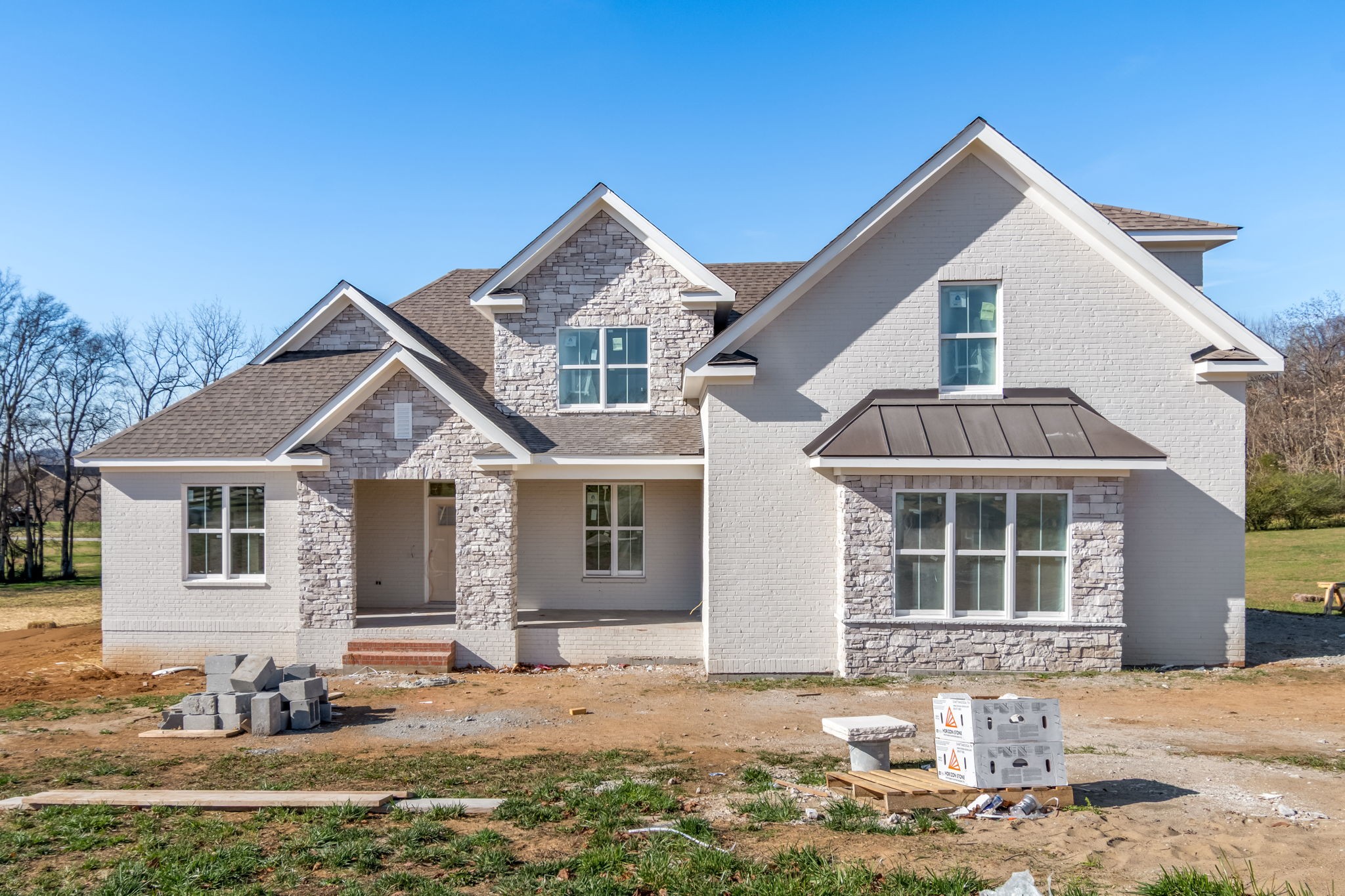 a front view of a house with a yard