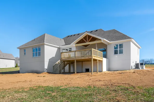 a view of a balcony with wooden floor