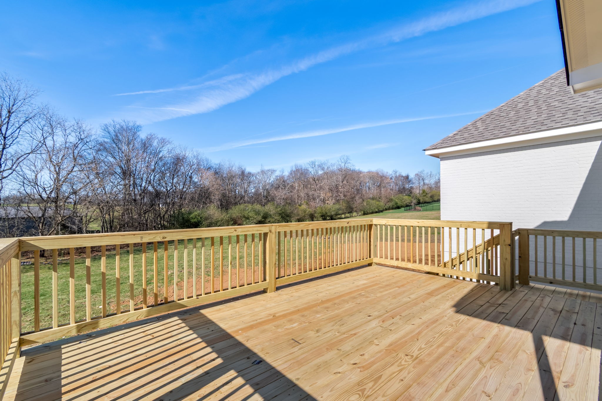 4019 Advocate Path Culleoka, TN 38451 - Photo 5 of 6 a view of a balcony with wooden floor and fence