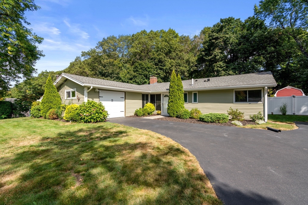 51 Griffin Road Framingham, MA 01701 - Photo 1 of 29 a front view of a house with a yard and garage