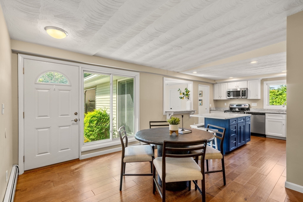 51 Griffin Road Framingham, MA 01701 - Photo 11 of 29 a view of a dining room with furniture and wooden floor