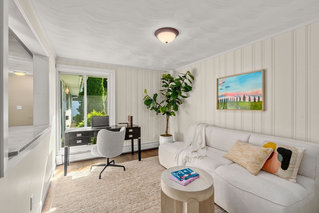 51 Griffin Road Framingham, MA 01701 - Photo 12 of 29 a living room with furniture and a potted plant