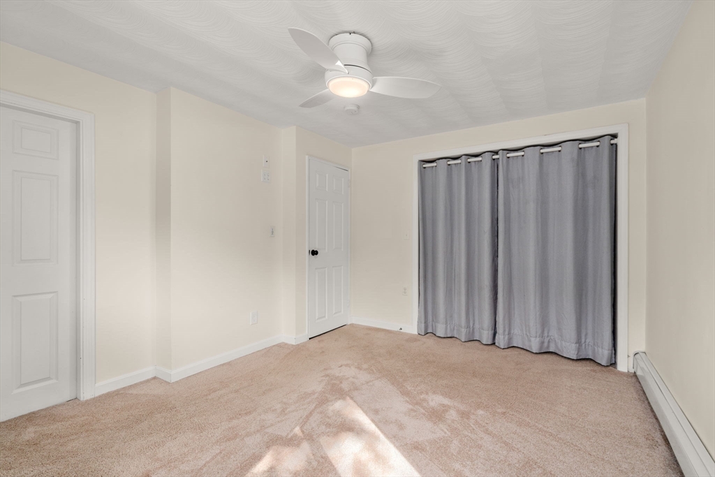 51 Griffin Road Framingham, MA 01701 - Photo 19 of 29 a view of a room with a hanging light