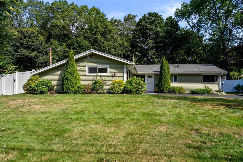 51 Griffin Road Framingham, MA 01701 - Photo 26 of 29 a front view of house with yard and green space