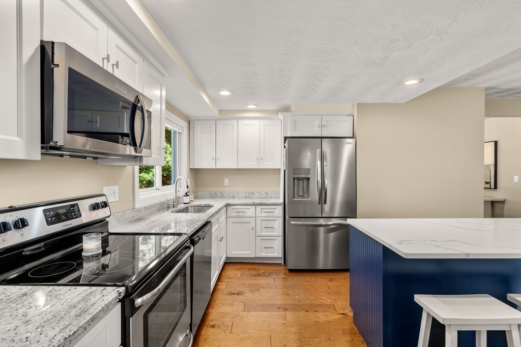 51 Griffin Road Framingham, MA 01701 - Photo 3 of 29 a kitchen with a sink stainless steel appliances and cabinets