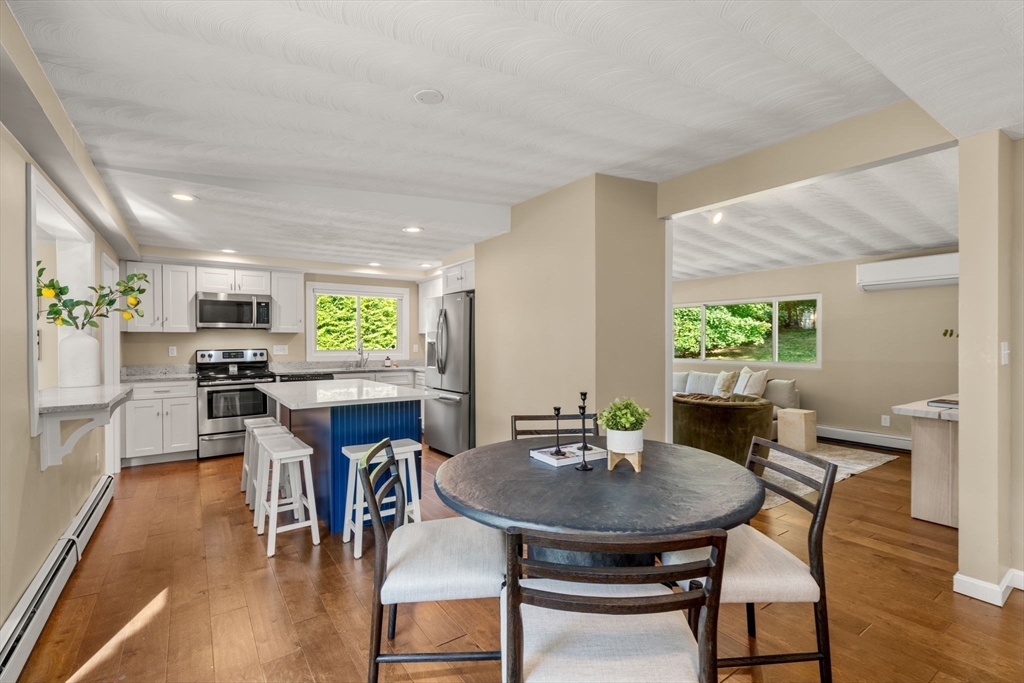 51 Griffin Road Framingham, MA 01701 - Photo 5 of 29 a view of a dining room with furniture and wooden floor