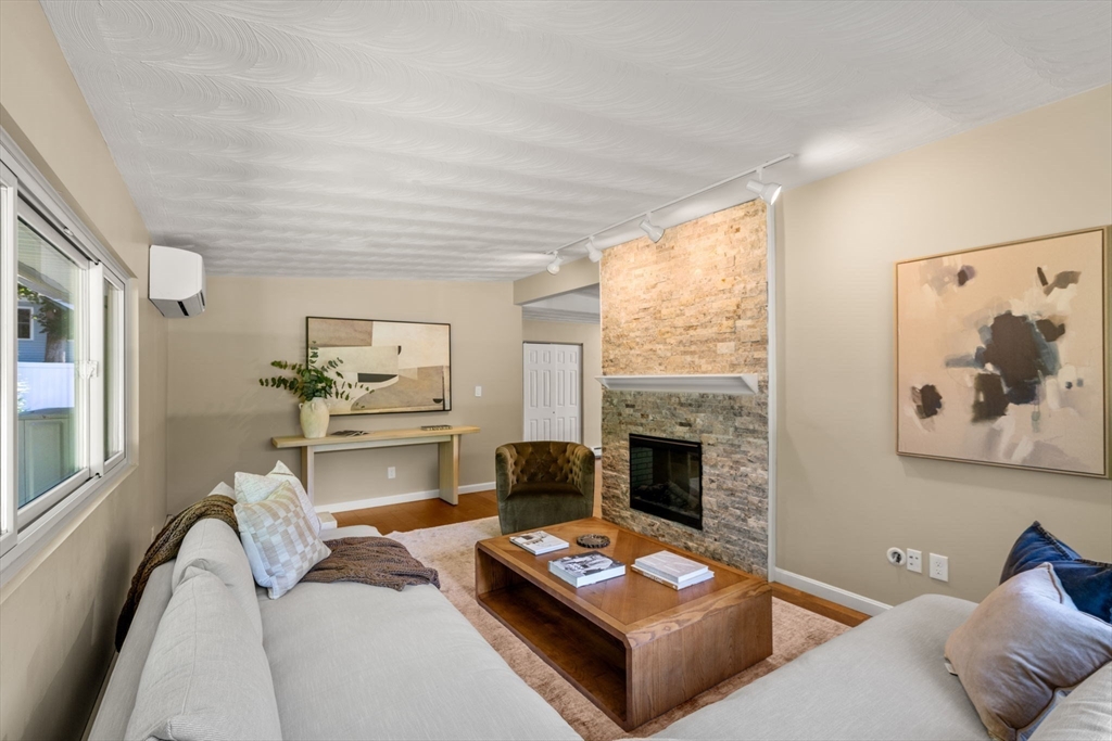 51 Griffin Road Framingham, MA 01701 - Photo 7 of 29 a living room with furniture and a fireplace