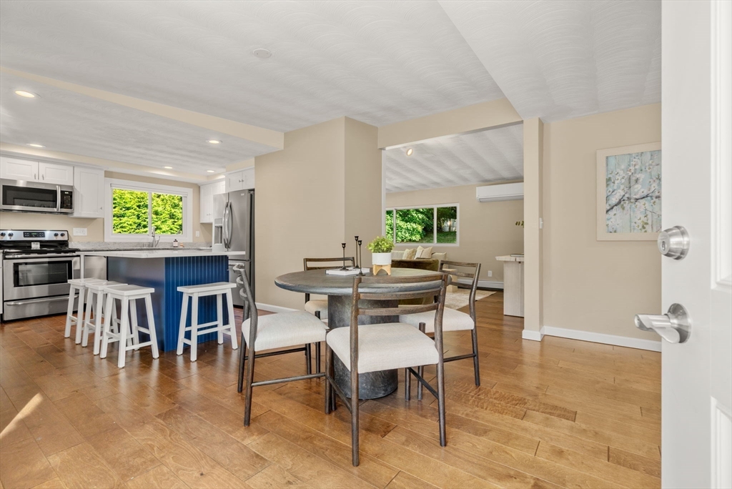 51 Griffin Road Framingham, MA 01701 - Photo 9 of 29 a dining room with furniture and wooden floor